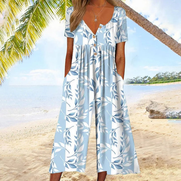 Women's effortless button-front culotte jumpsuit. Casual V-neck, short-sleeve, wide-leg design for summer comfort.