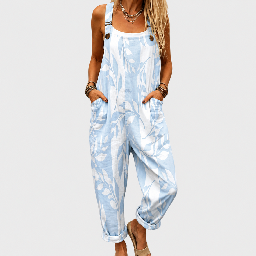 Women's effortless chic floral printed wide-leg jumpsuit with adjustable straps for summer comfort & versatile casual wear.