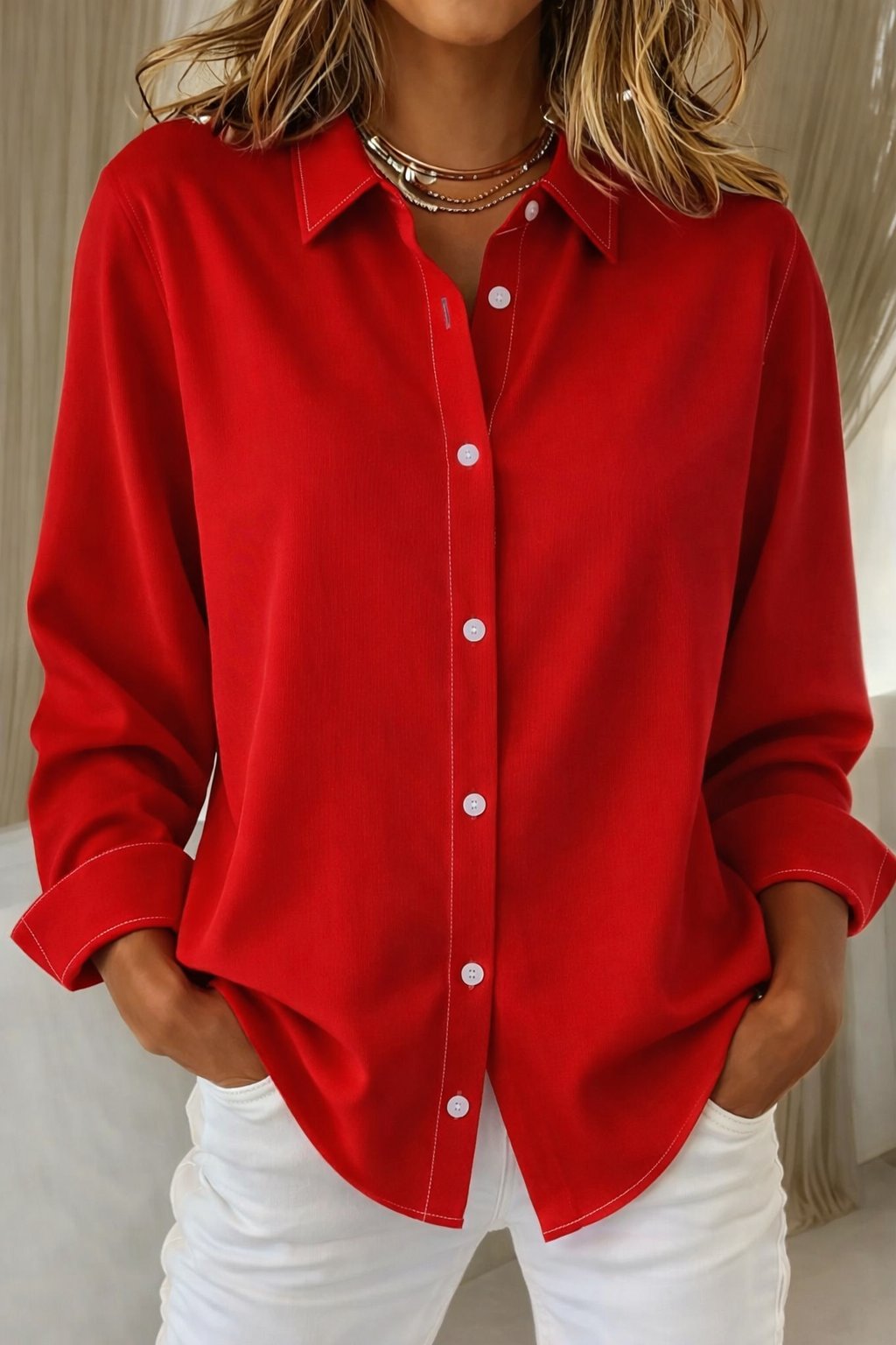 Relaxed-fit women's long-sleeve button-down blouse, a comfortable & stylish top for work or casual outfits.
