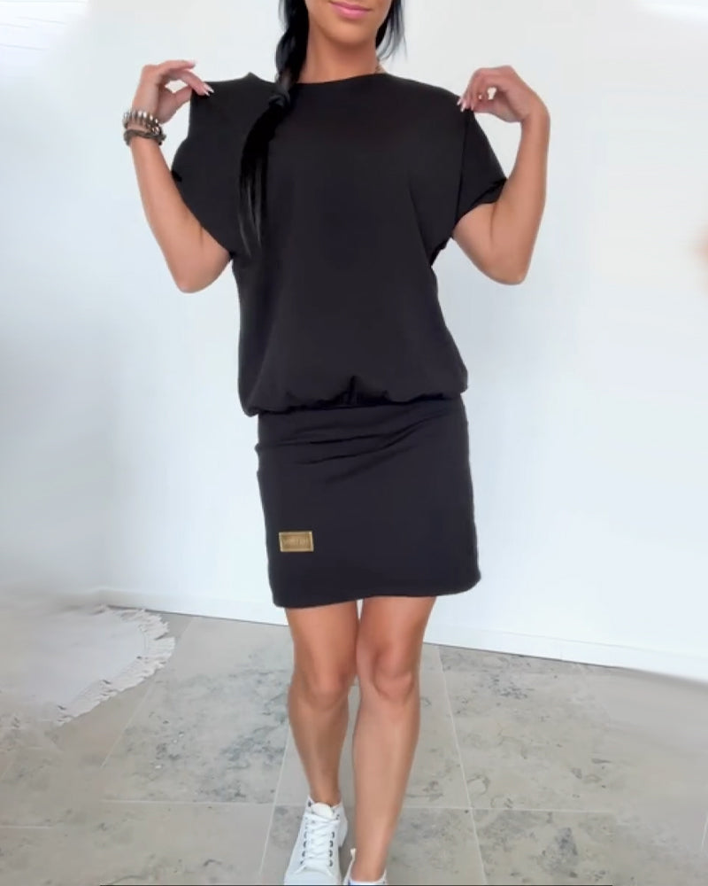 Modern women's casual elegant dress, a versatile piece for day to night. Effortless chic apparel.