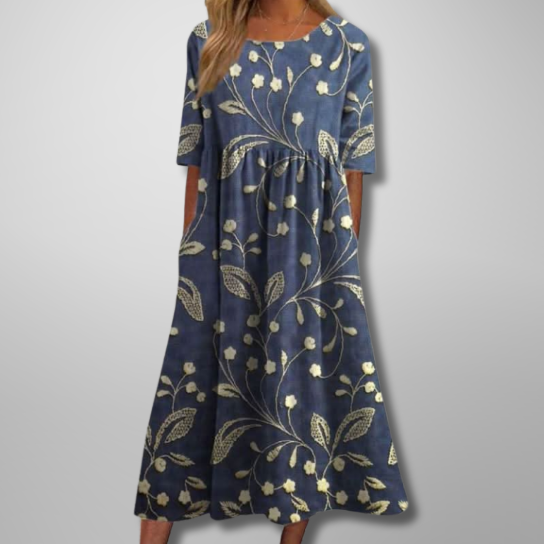 Women's effortless floral maxi dress with practical pockets, perfect for summer casual wear.