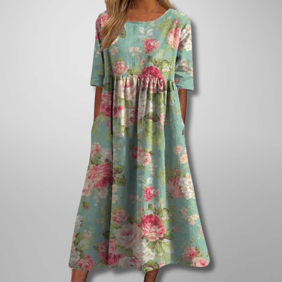 Flowy bohemian women's summer maxi dress featuring a vibrant floral print and convenient pockets.