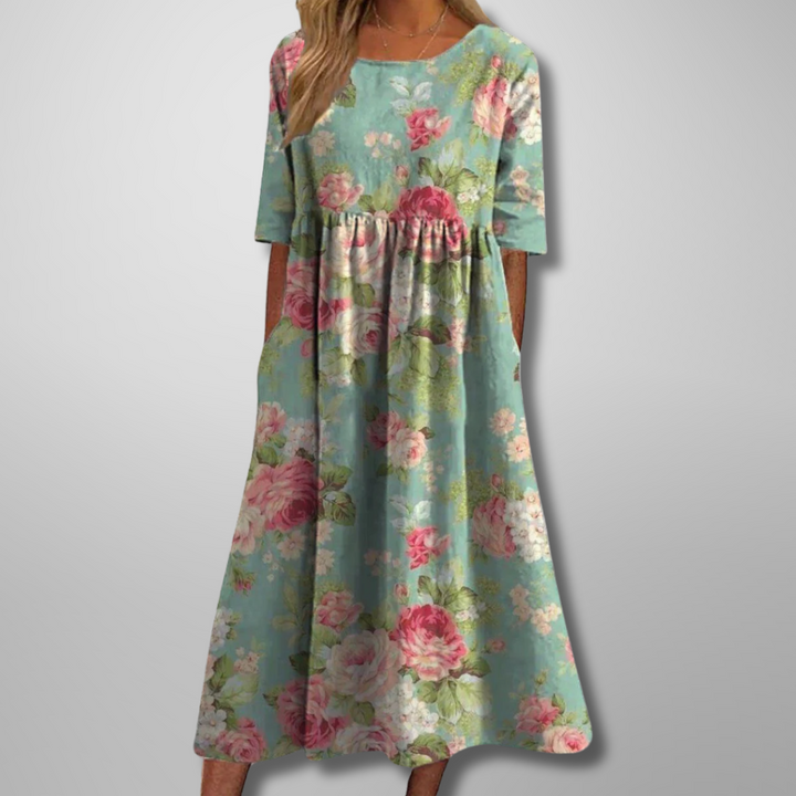 Flowy bohemian women's summer maxi dress featuring a vibrant floral print and convenient pockets.