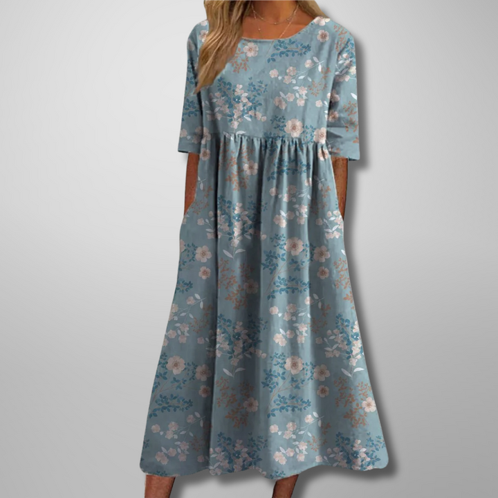 Elegant women's floral print maxi dress with a flowing silhouette, perfect for warm weather & everyday style.