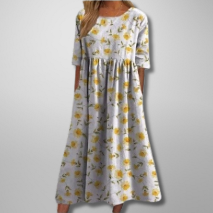 Close-up of the delicate floral pattern and practical side pockets on a women's summer maxi dress.