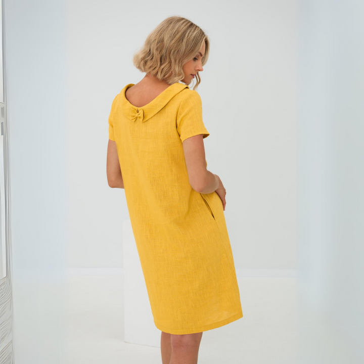 Effortless flowy women's summer midi dress, casual yet elegant, ideal for warm weather.