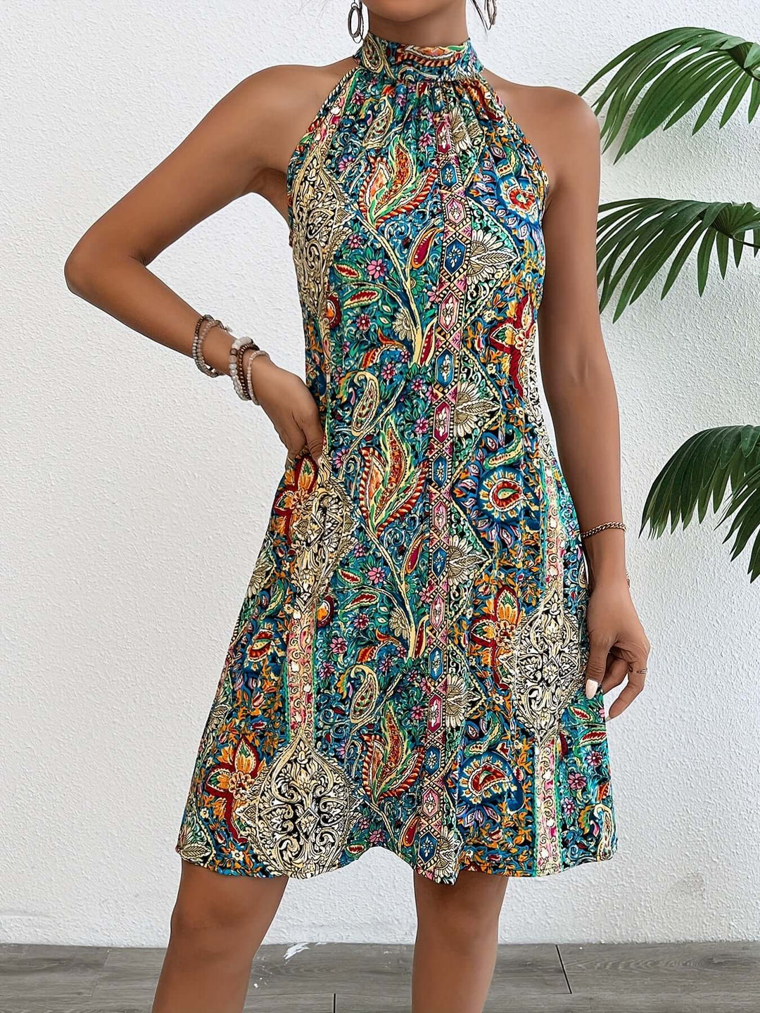 Women's Effortless Halter Boho Dress with a vibrant paisley print, perfect for summer.
