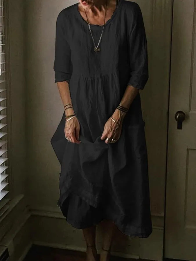 Casual women's midi dress with a loose, comfortable fit. Features stylish asymmetric hem and convenient side pockets.