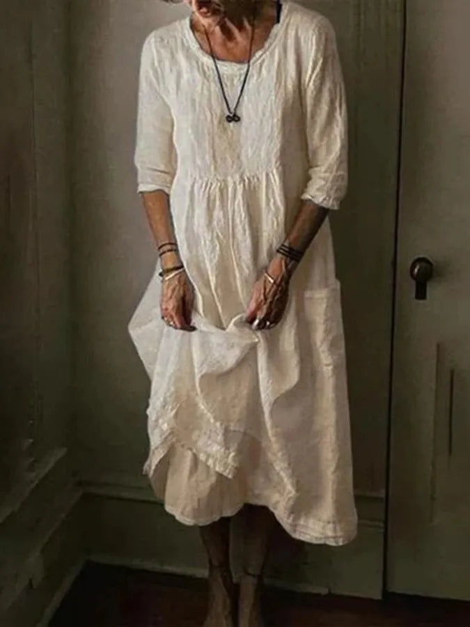 Versatile women's summer midi dress, loose fit with 3/4 sleeves & pockets. Perfect for casual wear & comfort.