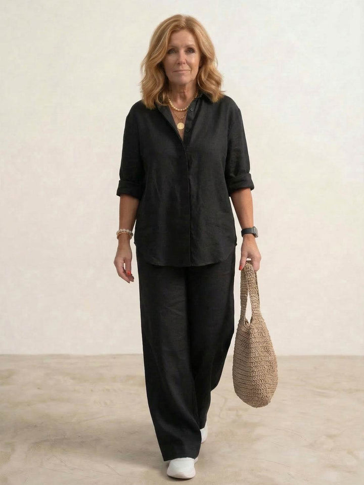 Stylish women's summer outfit: comfortable oversized shirt & elegant wide leg pants co-ord. Effortless fashion.