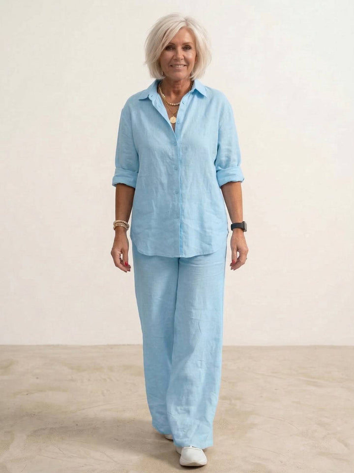 Women's relaxed fit two-piece set featuring a loose oversized shirt and comfortable wide-leg pants. Everyday chic.