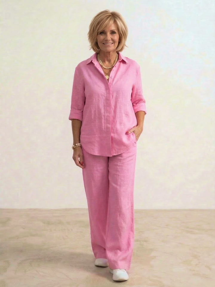 Fashionable women's spring set: oversized collared shirt & coordinating wide leg trousers for a chic look.