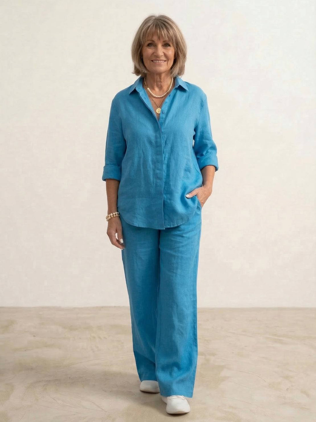 Women's versatile co-ord set with a long oversized shirt and flattering wide leg pants. Relaxed and modern.