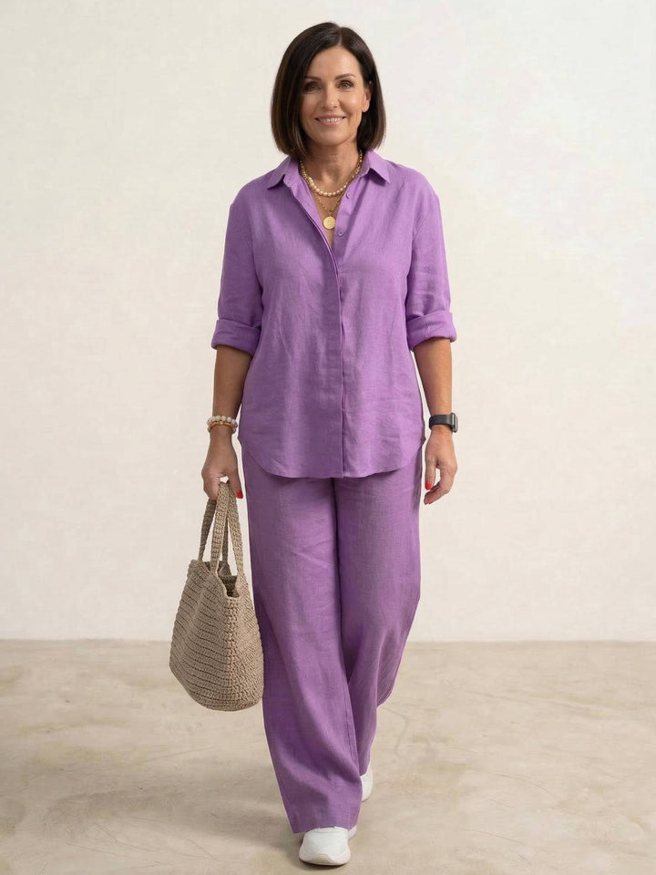 Effortless women's fashion: oversized shirt & wide leg pants set. Perfect for a comfortable, stylish summer outfit.