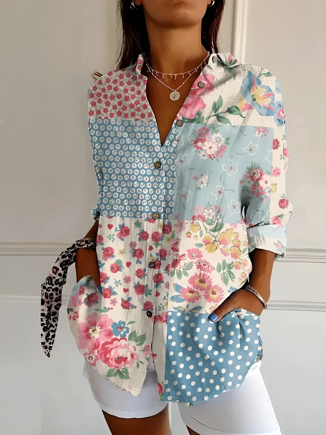 Elegant women's printed fashion top, button-front with collared design & three-quarter rolled cuffs. Workwear style.
