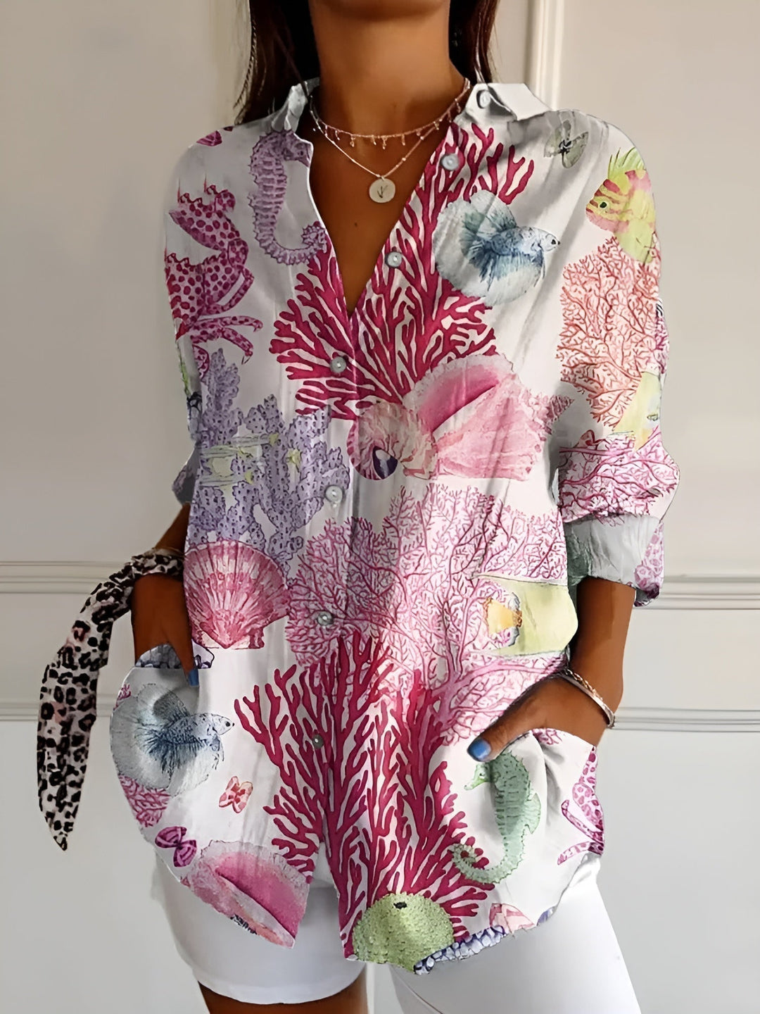 Comfortable women's casual printed blouse, button-front, rolled cuffs, rounded hem. Ideal for everyday spring style.