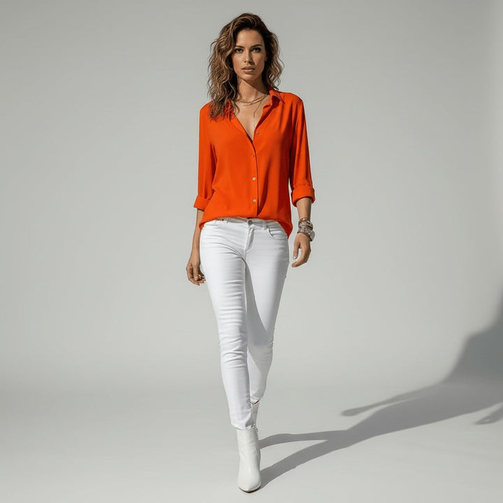 Effortless women's relaxed-fit button-up blouse, a go-to long sleeve top for versatility.