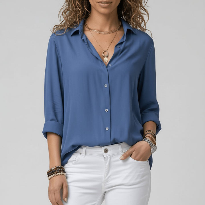 Versatile women's relaxed-fit button-up blouse, comfortable long sleeve everyday wear.