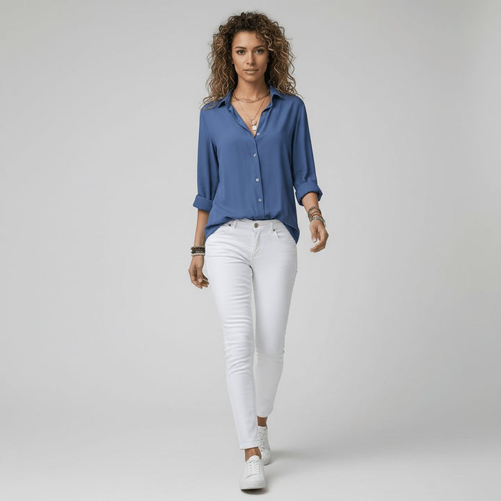 Elegant women's button-up blouse, relaxed-fit long sleeve perfect for smart casual style.