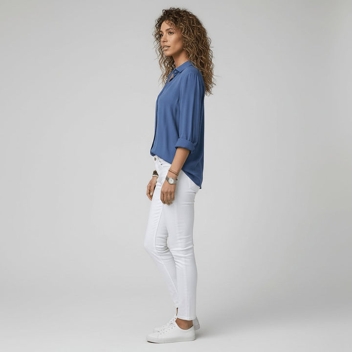 Classic women's long sleeve button-up blouse, relaxed-fit and ideal for everyday fashion.