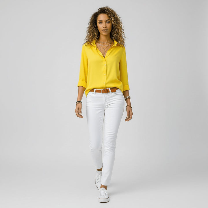 Relaxed-fit women's button-up blouse, an effortless long sleeve top for smart casual occasions.