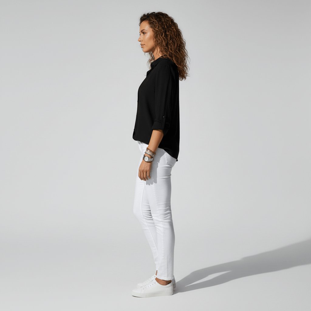 Relaxed-fit women's button-up blouse, a comfortable long sleeve top for smart casual style.