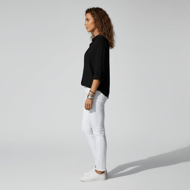 Relaxed-fit women's button-up blouse, a comfortable long sleeve top for smart casual style.