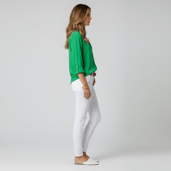 Modern women's long sleeve button-up blouse, relaxed-fit and versatile for any occasion.