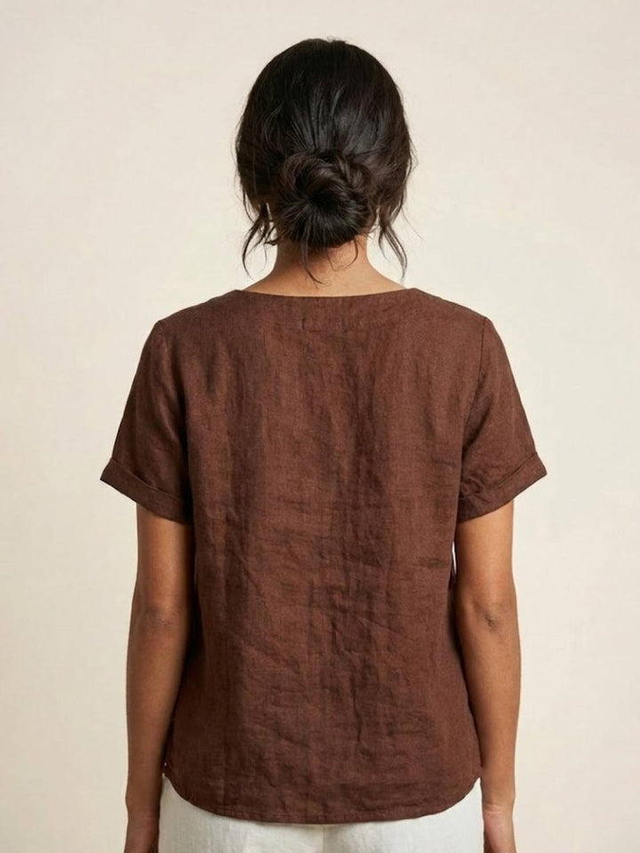 Casual women's button-up top, relaxed fit for summer comfort.