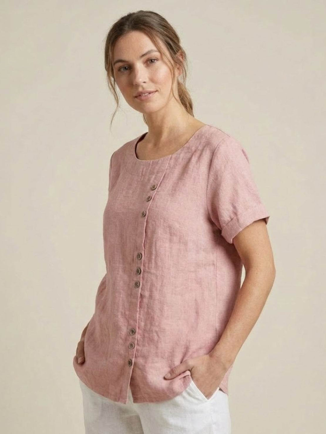 Versatile women's short sleeve blouse, ideal for summer casual looks.