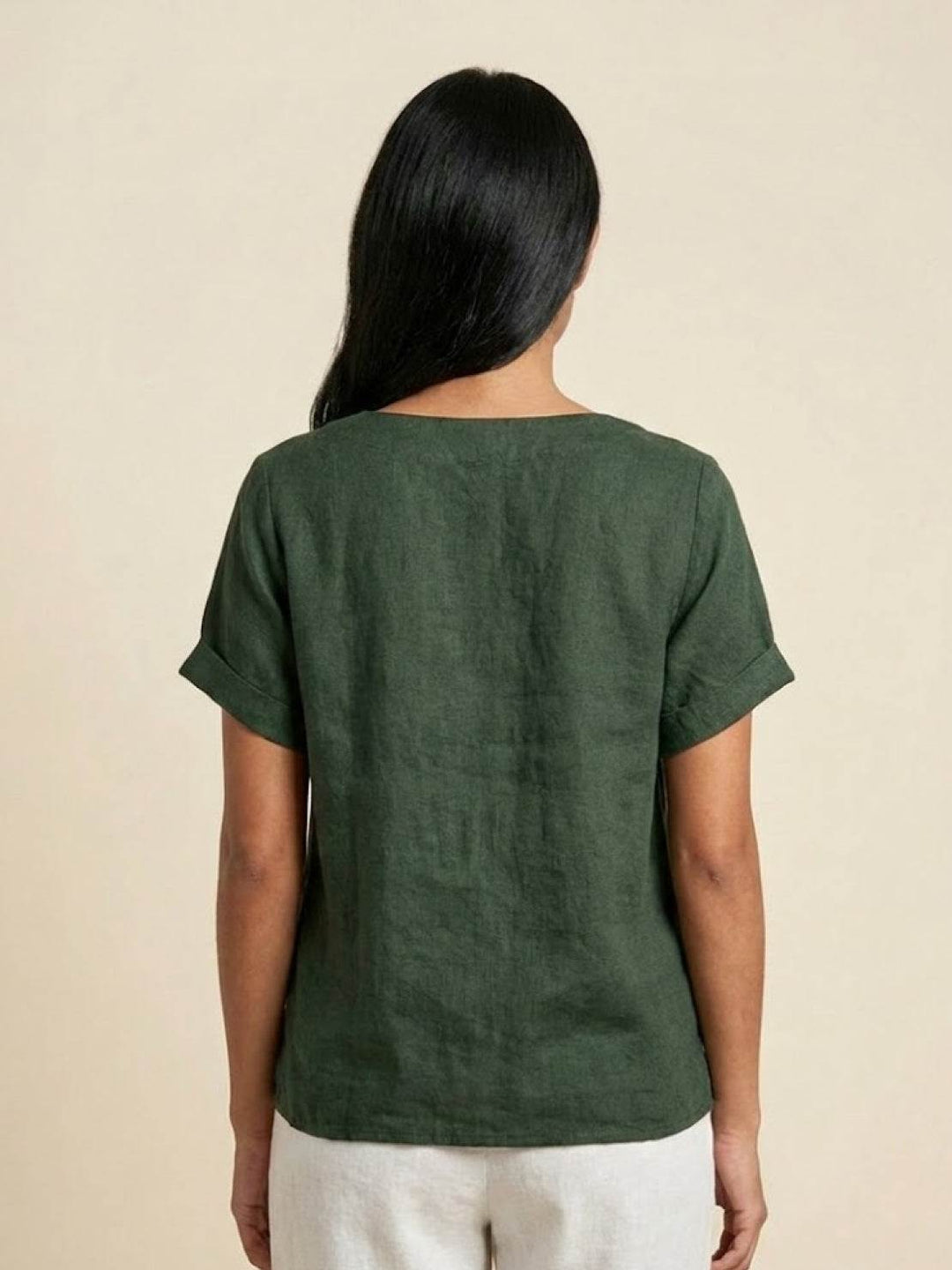 Stylish round neck button-up blouse, ideal for versatile summer fashion.