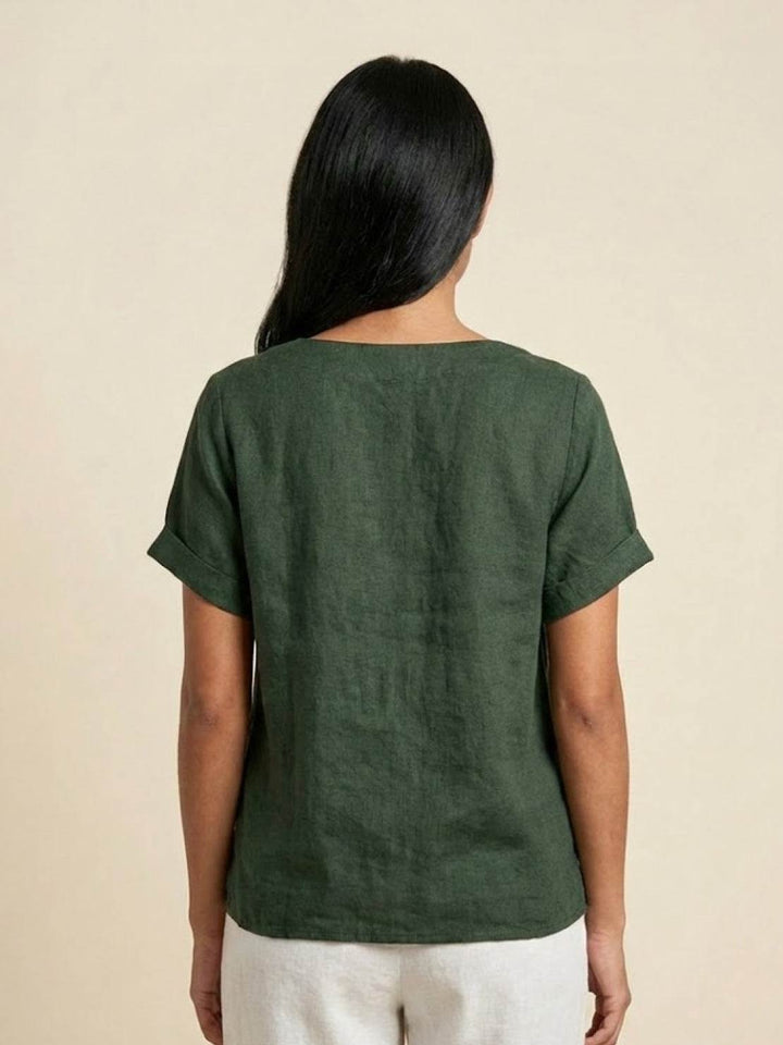 Stylish round neck button-up blouse, ideal for versatile summer fashion.