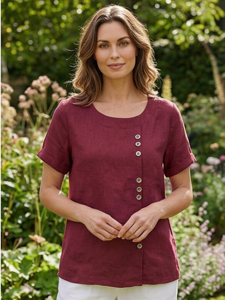 Effortless women's button-up blouse, loose fit for summer comfort.
