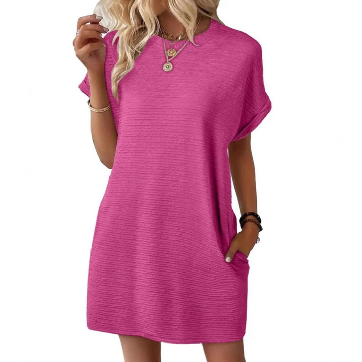 Women's effortless round neck midi summer dress, perfect for comfortable everyday warm weather wear. Flowy casual style.