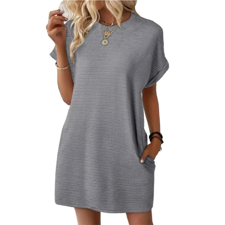 Model wearing a women's effortless round neck casual summer midi dress. Flowy & comfortable for warm weather style.