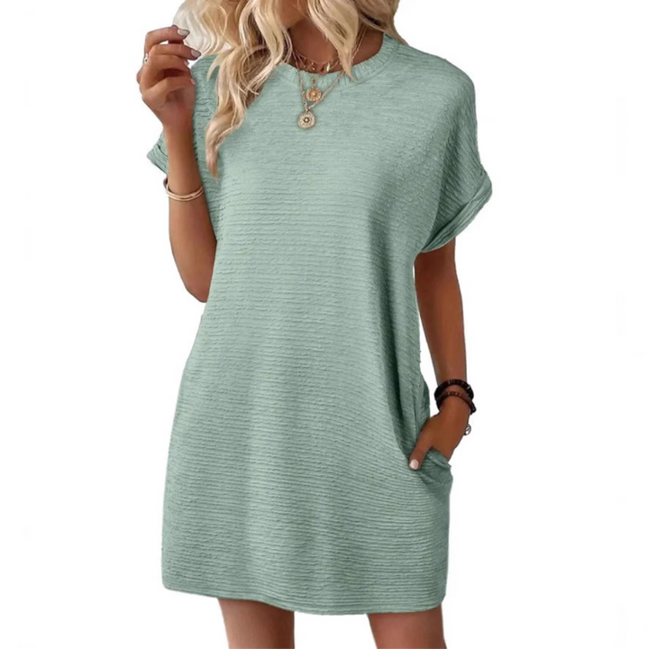 Effortless women's round neck summer dress in a soft, flowy fabric. Perfect comfortable midi for casual everyday wear.