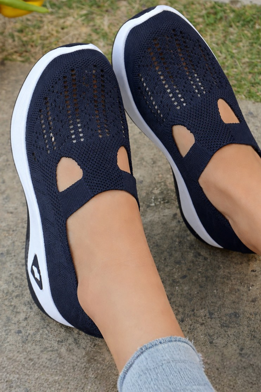 Close-up of breathable fabric on women's slip-on casual sneakers, highlighting texture & quality.