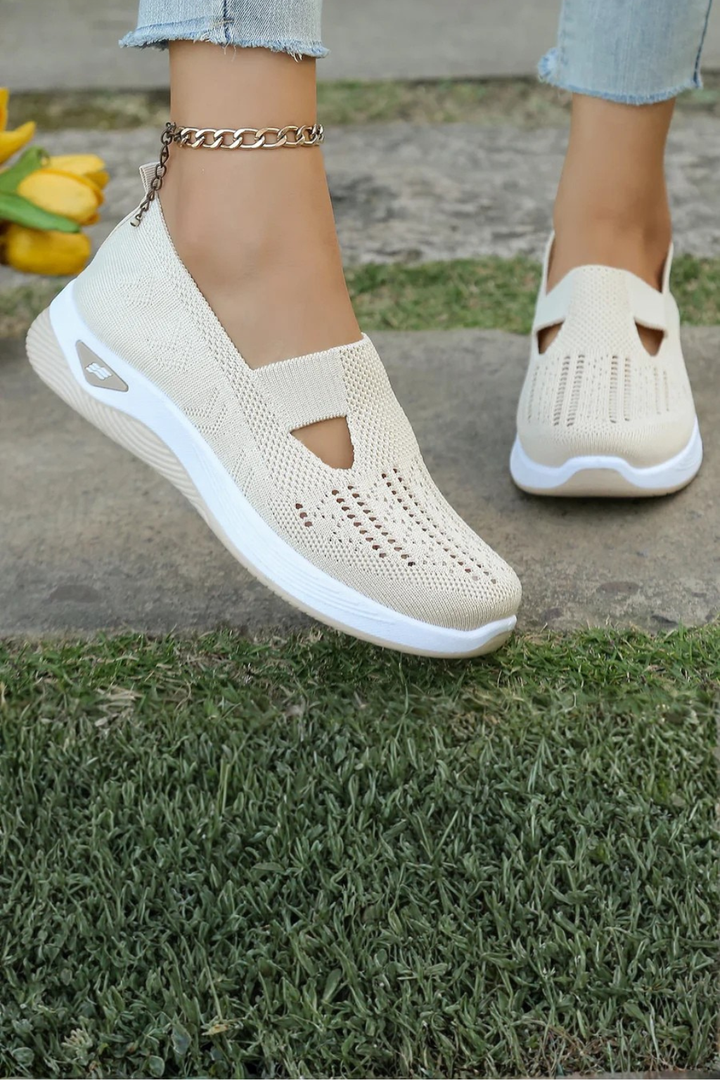 Front view of women's comfortable slip-on sneakers, showcasing the round toe design.