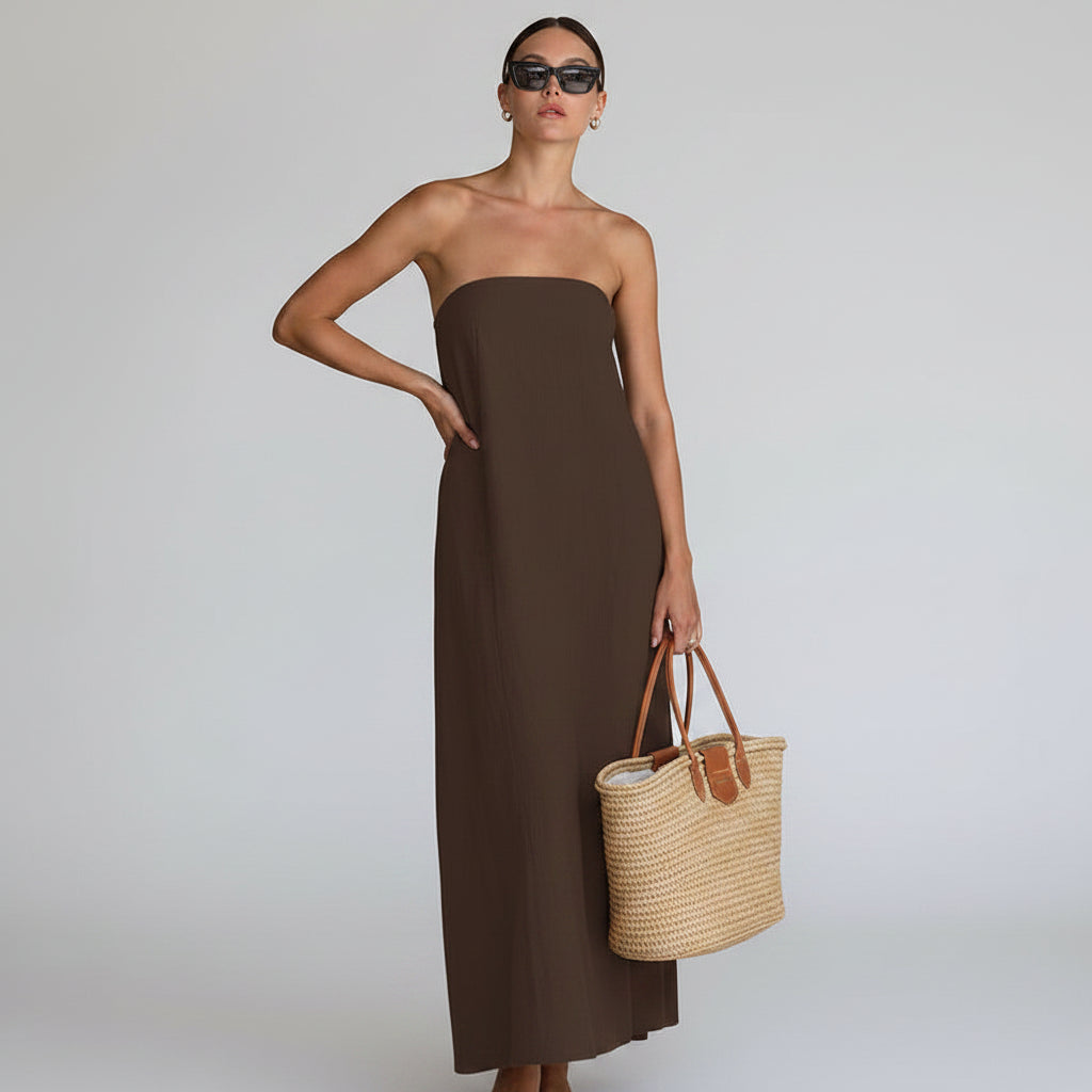 Chic women's flowy strapless maxi dress, ideal casual elegance for summer days.