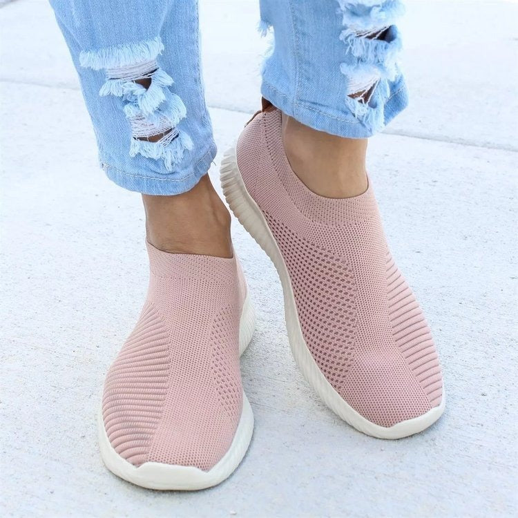Fashionable women's slip-on sneakers with a breathable design, ideal for casual wear.