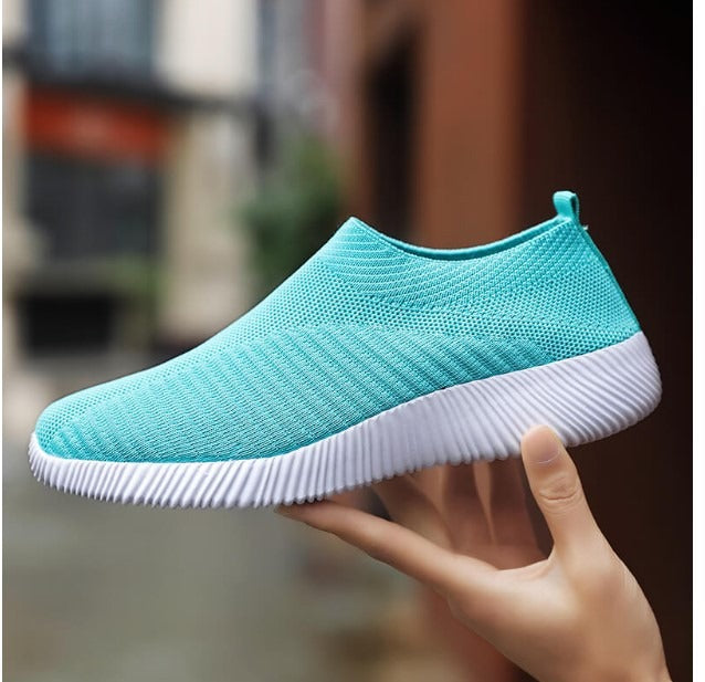 Breathable, lightweight women's slip-on sneakers for effortless style and all-day comfort.
