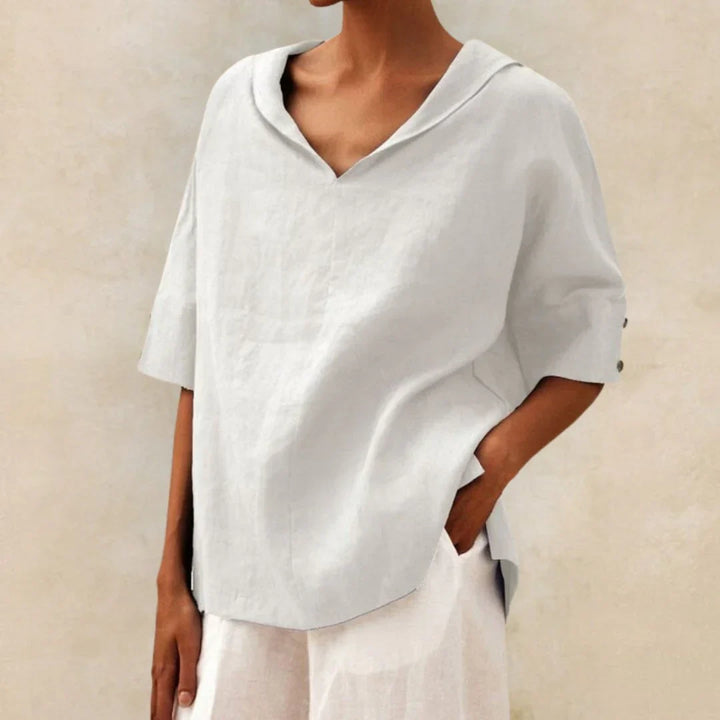 Women's effortless summer button-down shirt. Relaxed fit casual top, perfect for warm weather fashion.