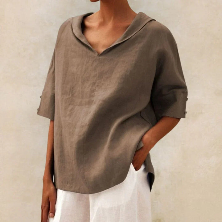 Classic women's button-down shirt. Long sleeve top suitable for elegant workwear or smart casual spring looks.