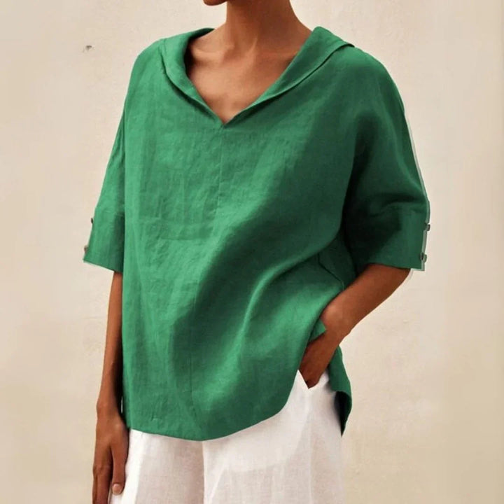 Relaxed fit women's summer button-down shirt. Comfortable casual top, essential for effortless beach fashion.