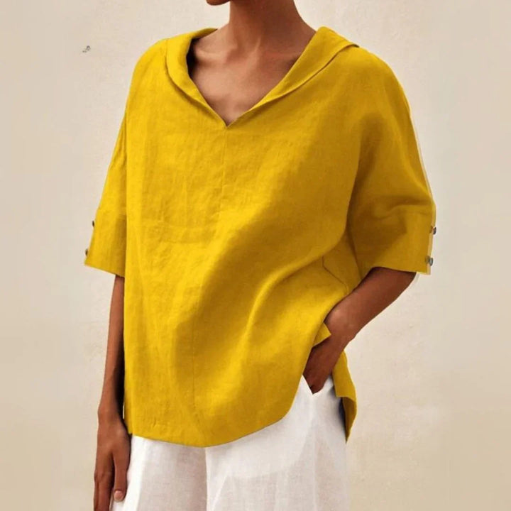 Chic women's long sleeve button-down. A classic spring fashion top, versatile for work or elegant summer wear.