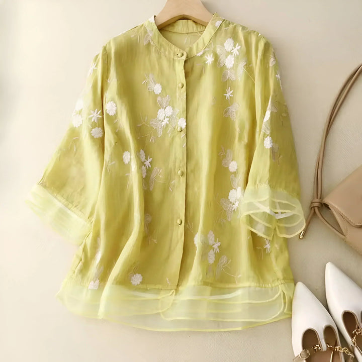 Effortless tummy-skimming top for women, combining relaxed fit, floral elegance & summer chic.