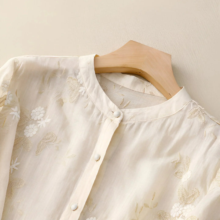 Round neck, short sleeve women's top with floral embroidery, everyday chic and flattering.