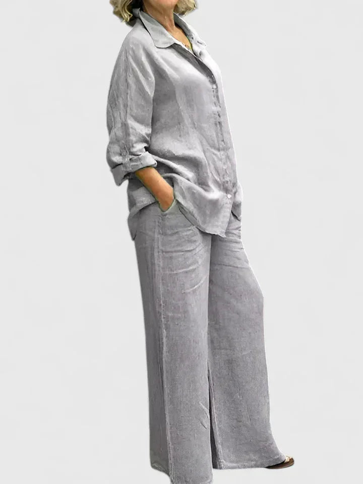 Chic women's two-piece set with a loose button-down shirt & wide leg pants, versatile for spring/summer.