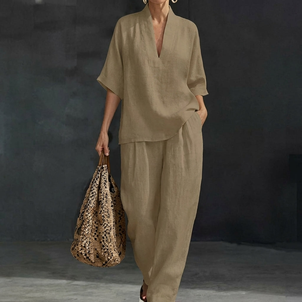 Effortless women's two-piece set, a stylish combination of top and wide-leg trousers for versatile everyday clothing.