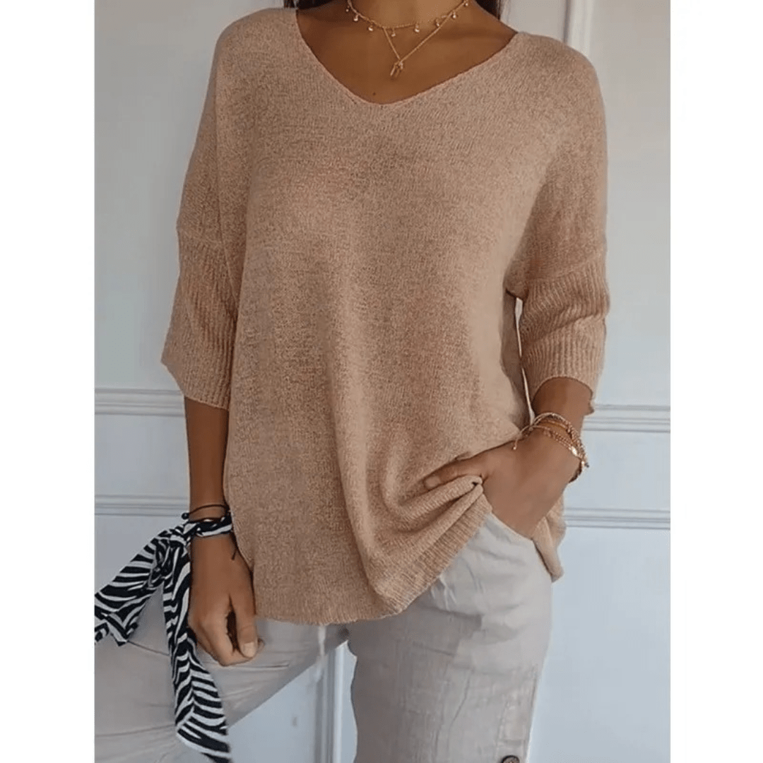 Women's casual V-neck 3/4 sleeve blouse, designed for comfortable, relaxed everyday style.